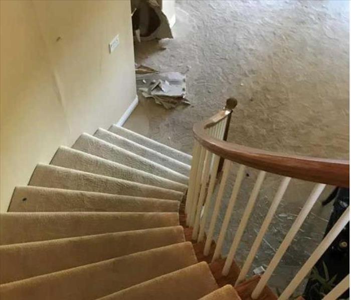 water damage on stairs resulting from a frozen pipe bursting